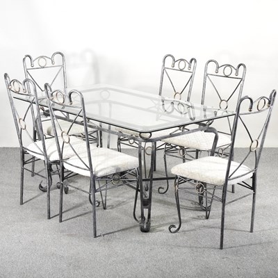 Lot 519 - A metal framed dining set, to include a glass...