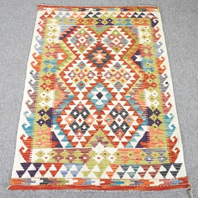 Lot 320 - A kilim rug, with all over coloured diamonds,...