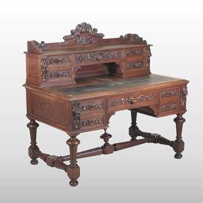 Lot 320 - A 19th century heavily carved dark oak kneehole desk