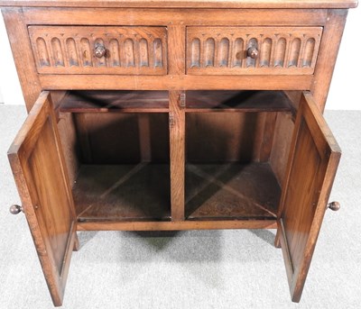 Lot 102 - A mid 20th century carved oak dresser, by...