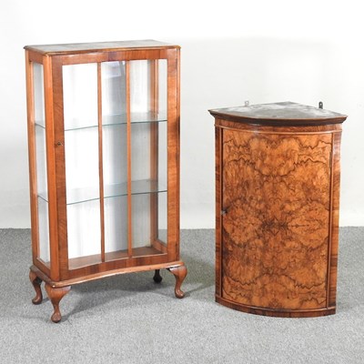 Lot 475 - A burr walnut bow front hanging corner cabinet,...