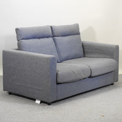 Lot 497 - A modern Ikea grey upholstered two seater sofa