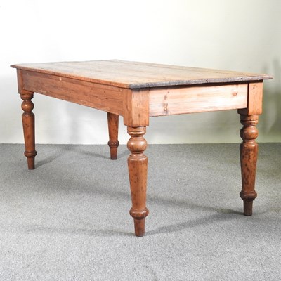 Lot 441 - An antique pine dining table, on turned legs