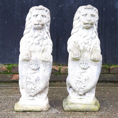 Lot 508 - A pair of cast stone garden statues of lions,...