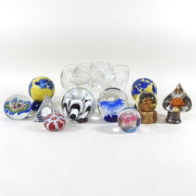 Lot 434 - A collection of glass paperweights, to include...