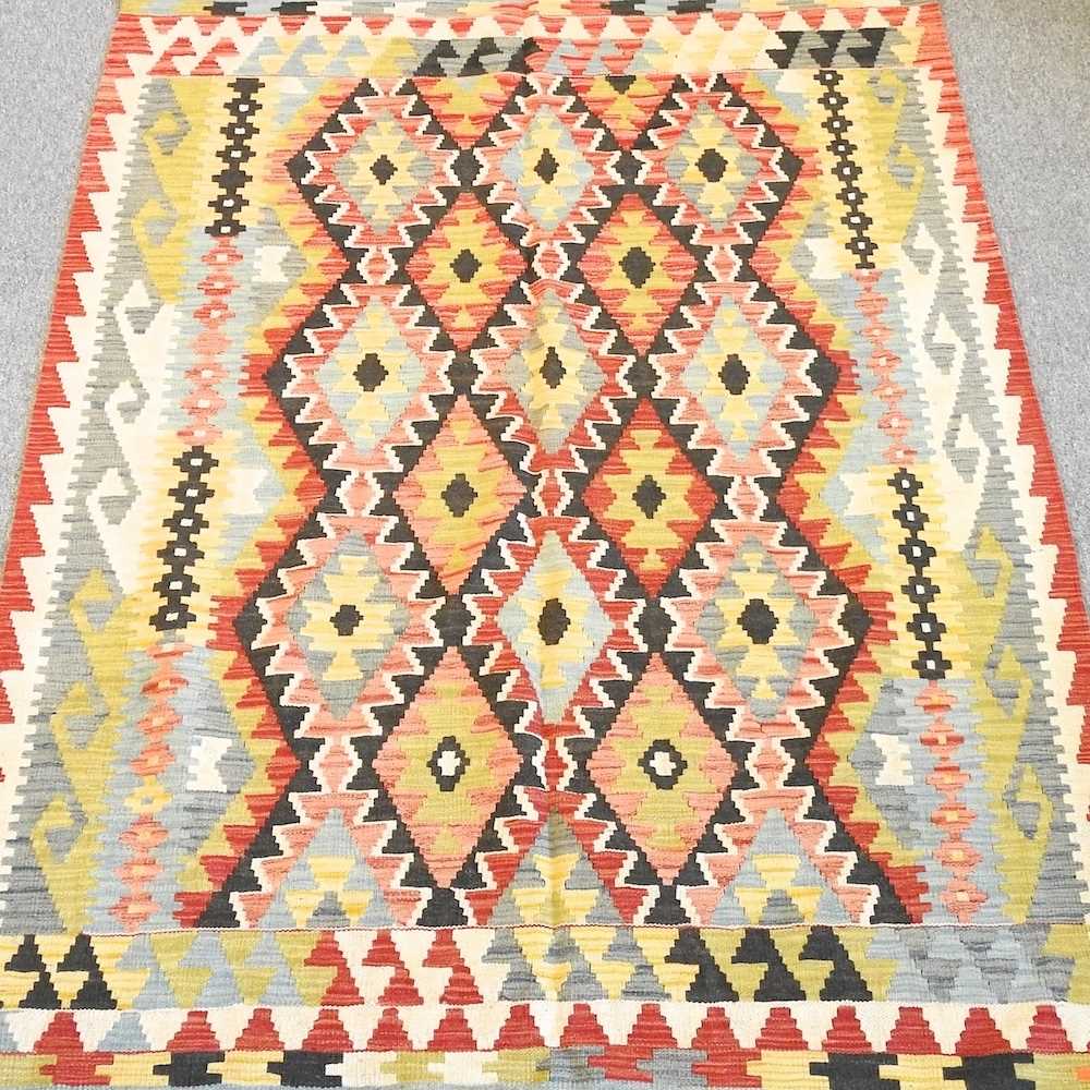 Lot 611 - A kilim rug, with coloured diamond pattern,