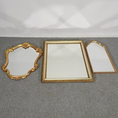 Lot 151 - A gilt wall mirror, of cartouche shape, 82 x...