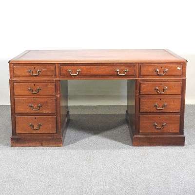 Lot 711 - An early 20th century pedestal desk, with an...