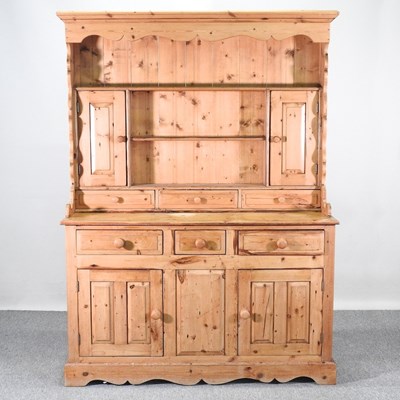 Lot 423 - A modern pine dresser, on a plinth base