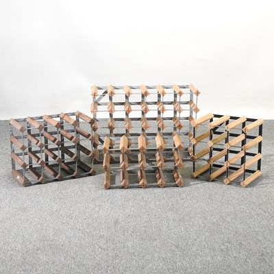 Lot 198 - A collection of four wine racks, largest 63cm...