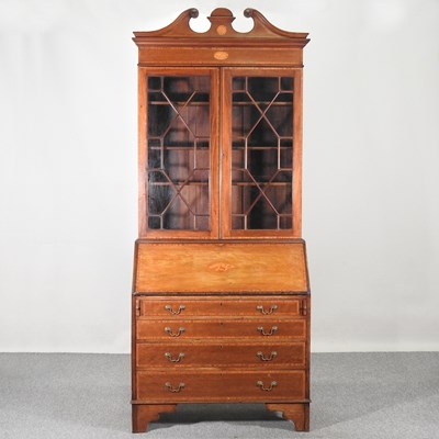 Lot 302 - An Edwardian mahogany bureau bookcase, with a...