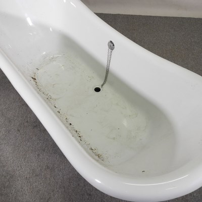 Lot 60 - A modern free standing roll top bath, on a...