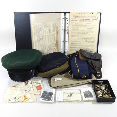 Lot 175 - A collection of militaria, to include caps,...