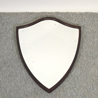 Lot 562 - A mahogany shield shape wall mirror