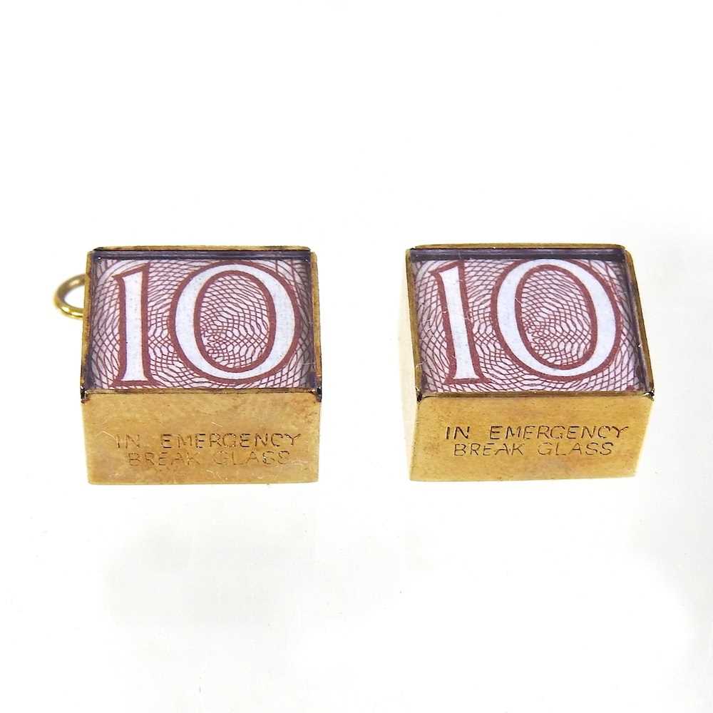 Lot 206 - Two 9 carat gold charms, each containing a ten...