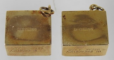 Lot 206 - Two 9 carat gold charms, each containing a ten...