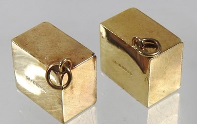 Lot 206 - Two 9 carat gold charms, each containing a ten...