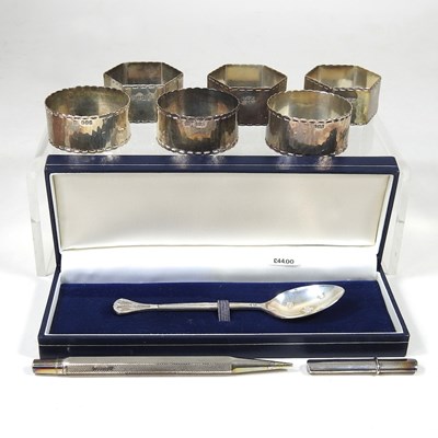 Lot 511 - A set of three hexagonal silver napkin rings,...