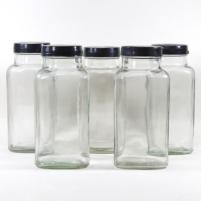 Lot 518 - A collection of five vintage glass sweet jars,...