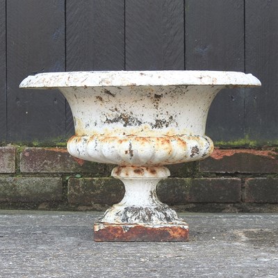 Lot 420 - A Victorian cast iron campana shape garden urn