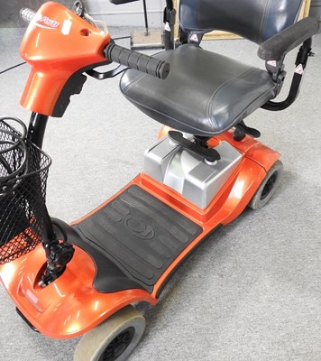 Lot 21 - An orange Kymco electric mobility scooter,...