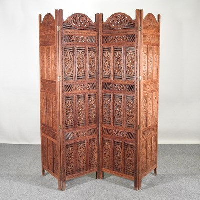 Lot 319 - An Indian carved hardwood four-fold dressing...