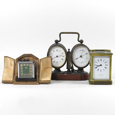 Lot 164 - A 19th century brass cased clock/barometer, on...