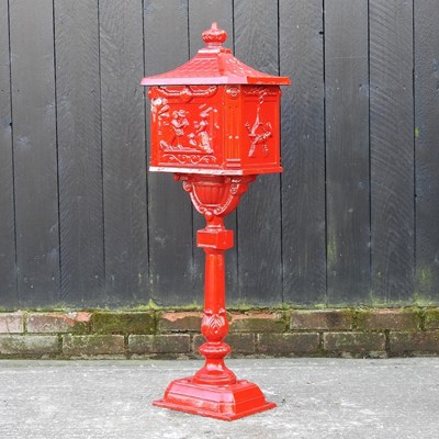 Lot 323 - A red painted metal letter box