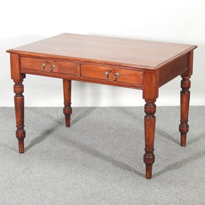 Lot 125 - An early 20th century pine writing table, on...