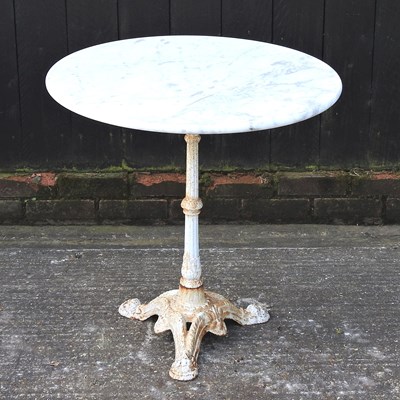 Lot 415 - A cast iron garden table