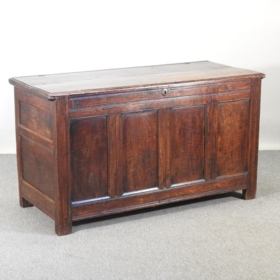 Lot 101 - An 18th century panelled oak coffer, with a...