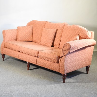 Lot 680 - A modern peach upholstered sofa, recently...