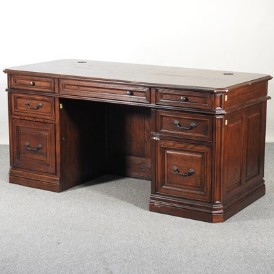 Lot 180 - A modern oak pedestal desk, on a plinth base