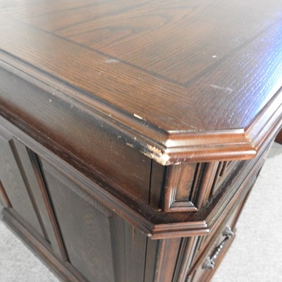 Lot 180 - A modern oak pedestal desk, on a plinth base