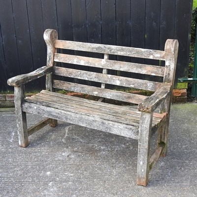 Lot 330 - A teak garden bench