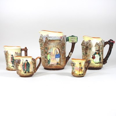 Lot 675 - Five Royal Doulton series ware graduated jugs,...