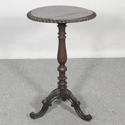 Lot 213 - A Victorian carved oak wine table, on a tripod...