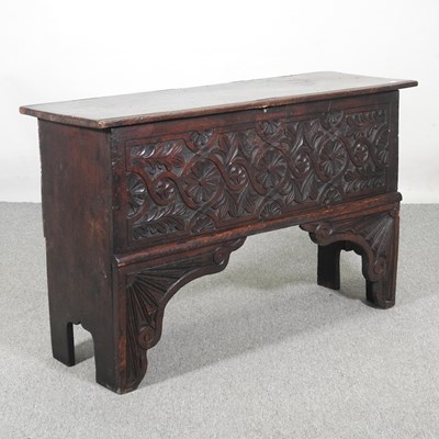 Lot 130 - An 18th century and later carved oak six plank...