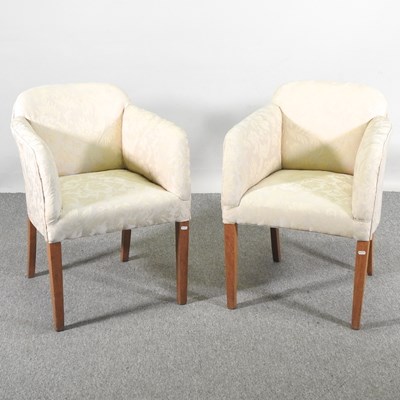 Lot 594 - A pair of Art Deco cream upholstered armchairs...