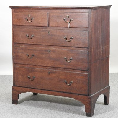 Lot 322 - A George III oak chest