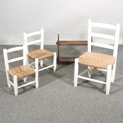 Lot 641 - Three white painted child's chairs, together...