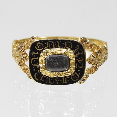 Lot 2 - A Victorian enamelled mourning ring, inset...