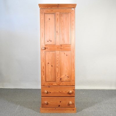 Lot 330 - A modern pine cupboard, with drawers below