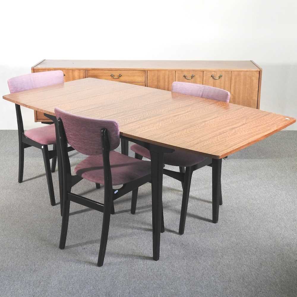 Lot 47 - A 1970's Nathan dining suite, comprising an...
