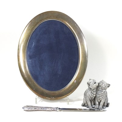 Lot 38 - A modern silver model of two cats, shown...