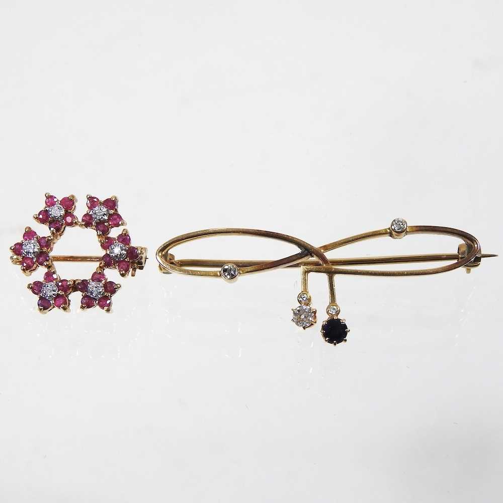 Lot 11 - A 9 carat gold, ruby and diamond brooch, of...