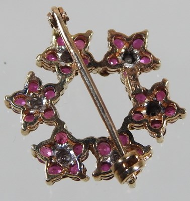 Lot 11 - A 9 carat gold, ruby and diamond brooch, of...