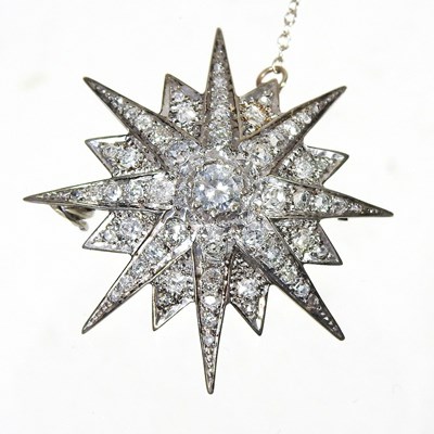 Lot 106 - A diamond target brooch, of graduated star...