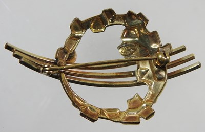 Lot 24 - A 14 carat rolled gold brooch, of openwork...