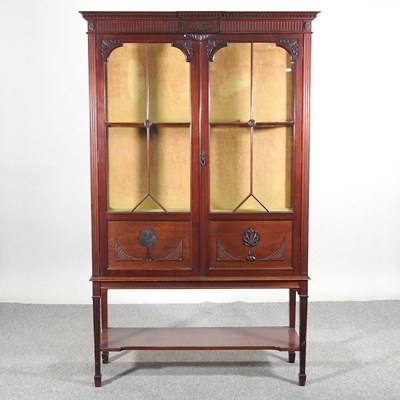 Lot 114 - An Edwardian glazed display cabinet, on square...